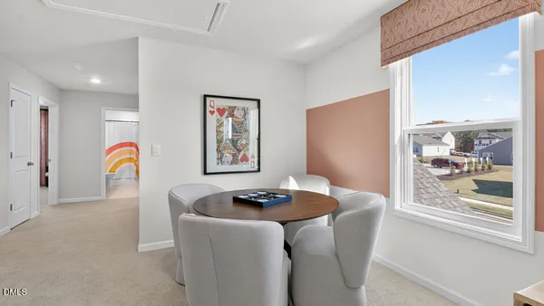 a dining room with furniture and window