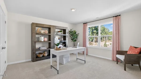 a workspace with furniture and a window