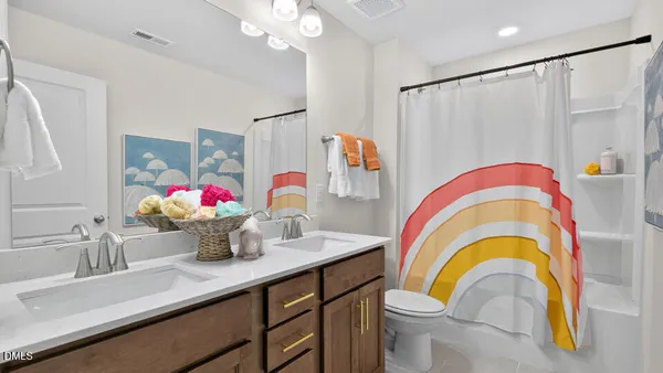 a bathroom with a sink a mirror and a shower curtain