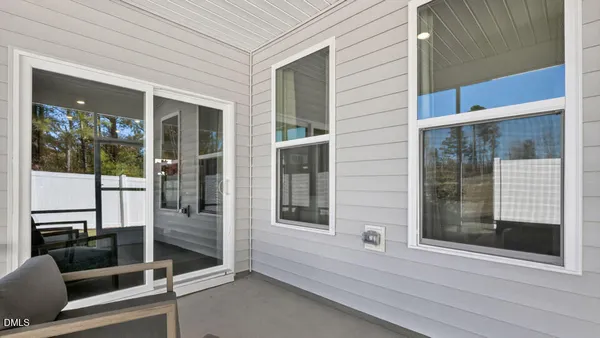 a view of house with backyard