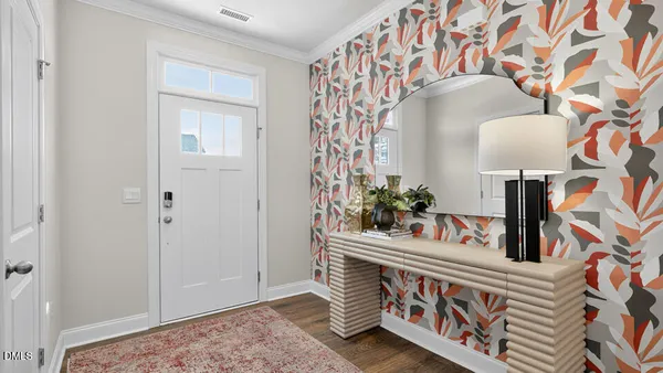 a view of an entryway with wooden floor