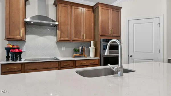 a kitchen with a sink and a refrigerator