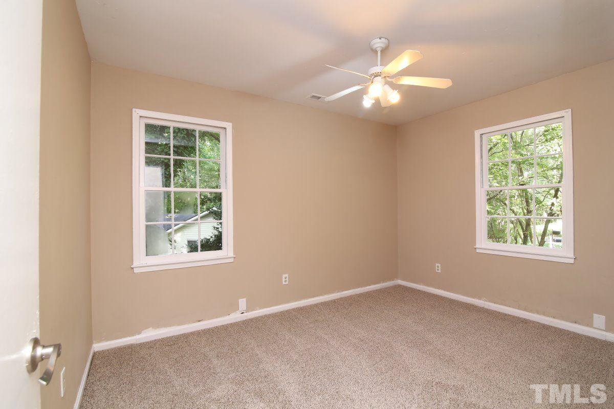 7700 Greentree Court Raleigh, NC 27615 - Photo 20 of 25 an empty room with a window