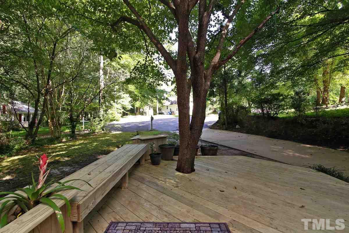 7700 Greentree Court Raleigh, NC 27615 - Photo 3 of 25 a view of a park with large trees