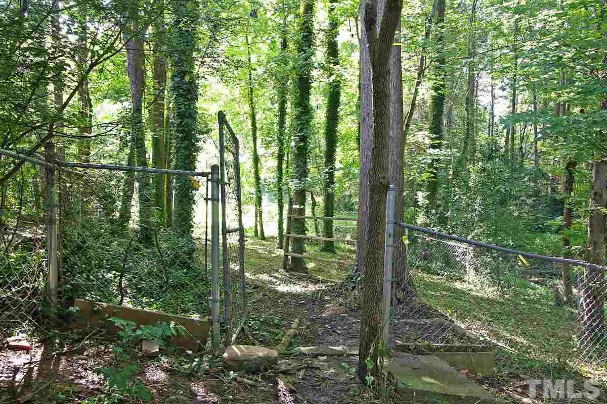7700 Greentree Court Raleigh, NC 27615 - Photo 7 of 25 a view of outdoor space and a yard