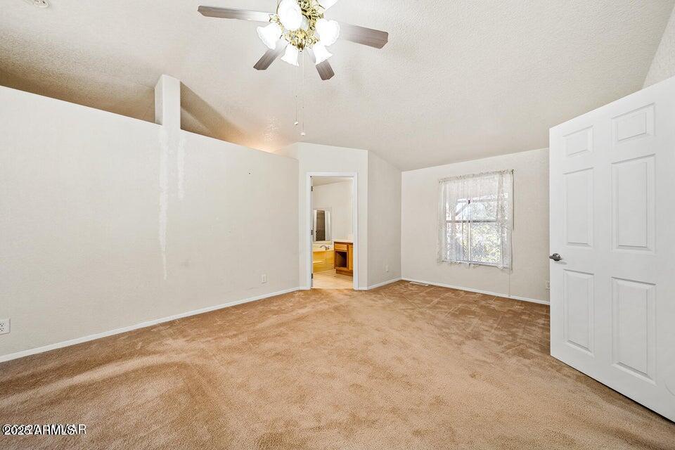 2421 West Thornton Road Show Low, AZ 85901 - Photo 20 of 48 a view of an empty room with a window