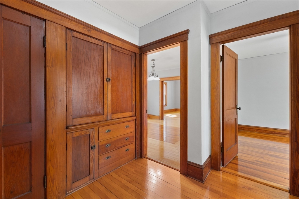 183 Pleasant Street, Unit 2 Grafton, MA 01560 - Photo 13 of 34 a view of a hallway with wooden floor