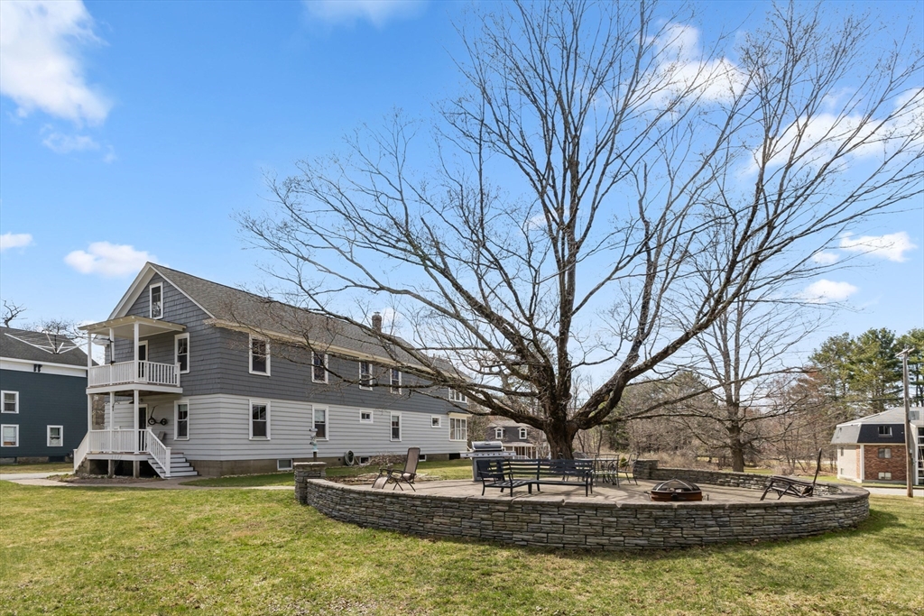 183 Pleasant Street, Unit 2 Grafton, MA 01560 - Photo 34 of 34 a view of pool with building and trees in the background