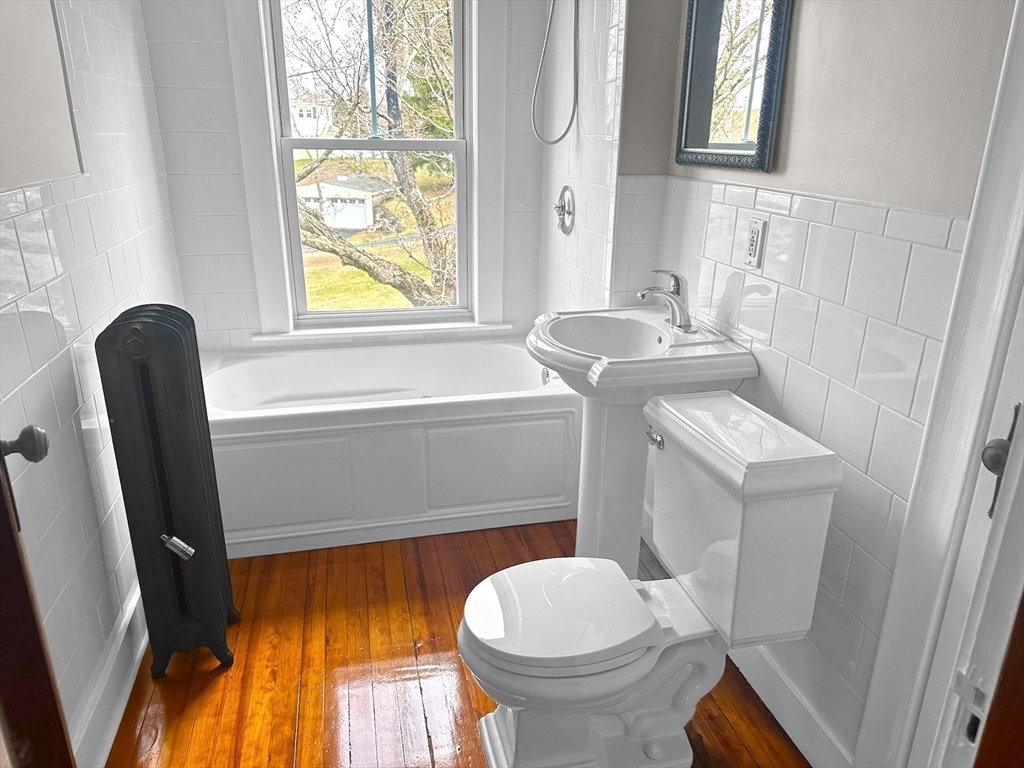 183 Pleasant Street, Unit 2 Grafton, MA 01560 - Photo 9 of 34 a bathroom with a sink and a toilet