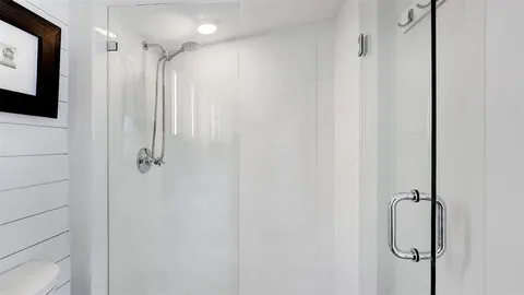 a bedroom with a bed and a table in it