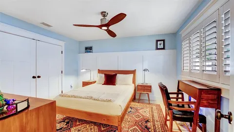 a bathroom with a granite countertop sink a mirror and a shower