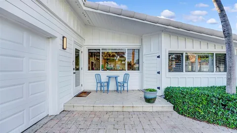 a spacious bedroom with a bed and a view of bathroom