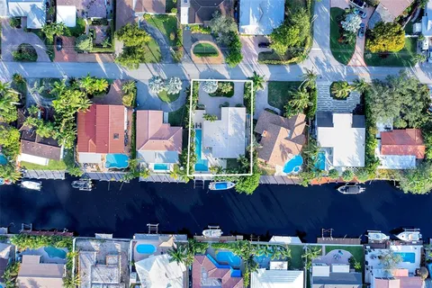 an aerial view of a house with a yard and a garden