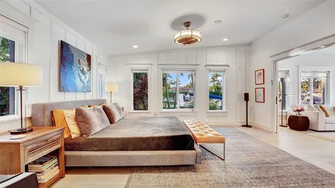 a view of backyard with potted plants and a palm tree