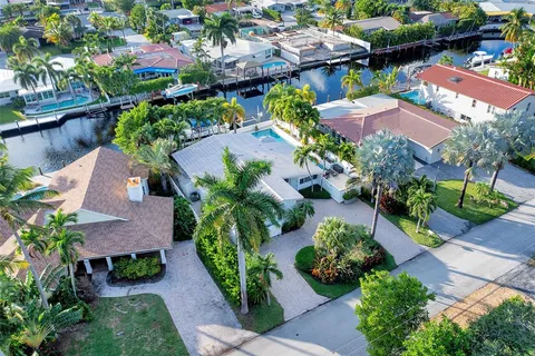 an aerial view of a house with garden space and street view