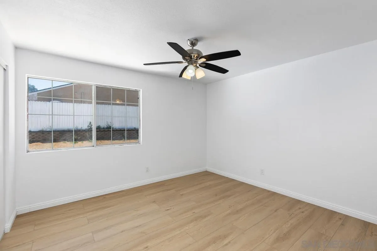 13749 Avenida Del Charro El Cajon, CA 92021 - Photo 13 of 24 an empty room with a window and a fan