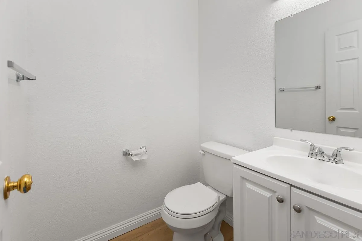 13749 Avenida Del Charro El Cajon, CA 92021 - Photo 17 of 24 a bathroom with a sink toilet and a mirror