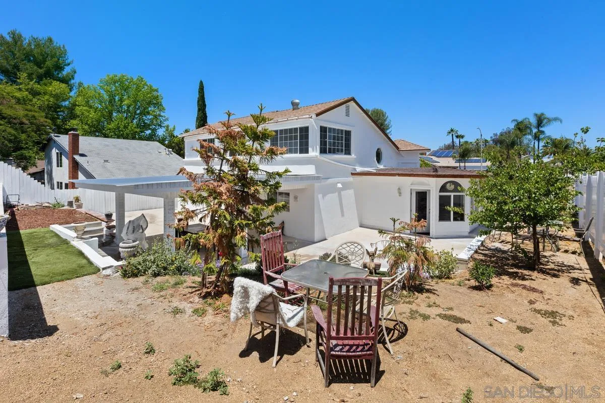 13749 Avenida Del Charro El Cajon, CA 92021 - Photo 21 of 24 a view of house with patio outdoor seating and entertaining space