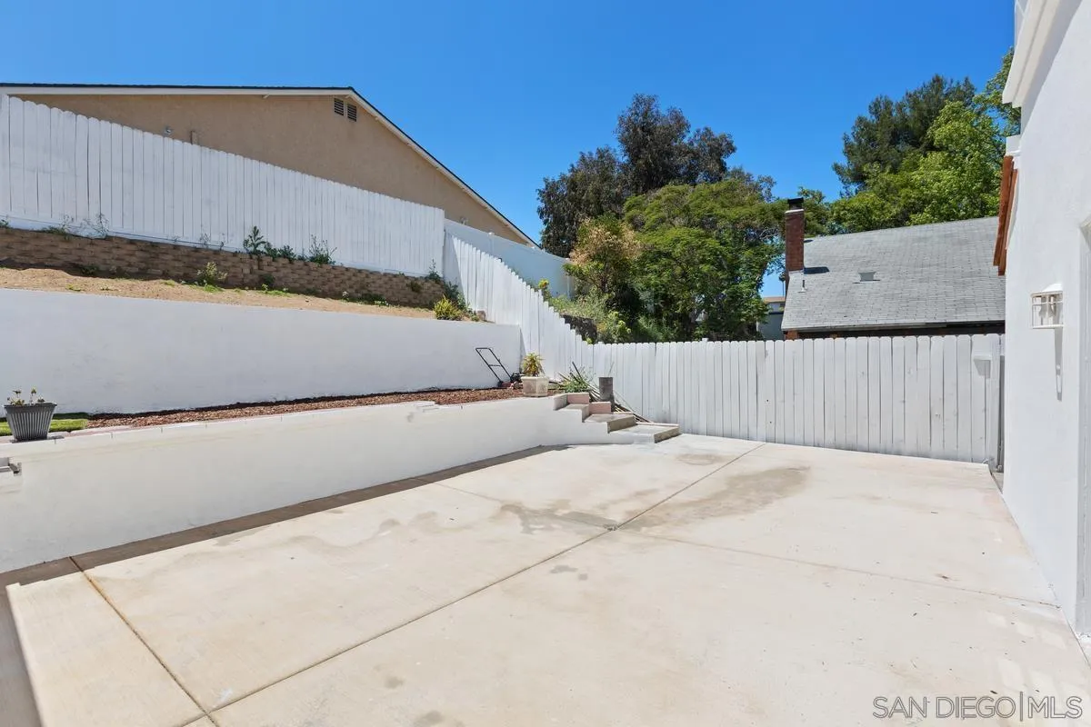 13749 Avenida Del Charro El Cajon, CA 92021 - Photo 22 of 24 a view of a building in the background