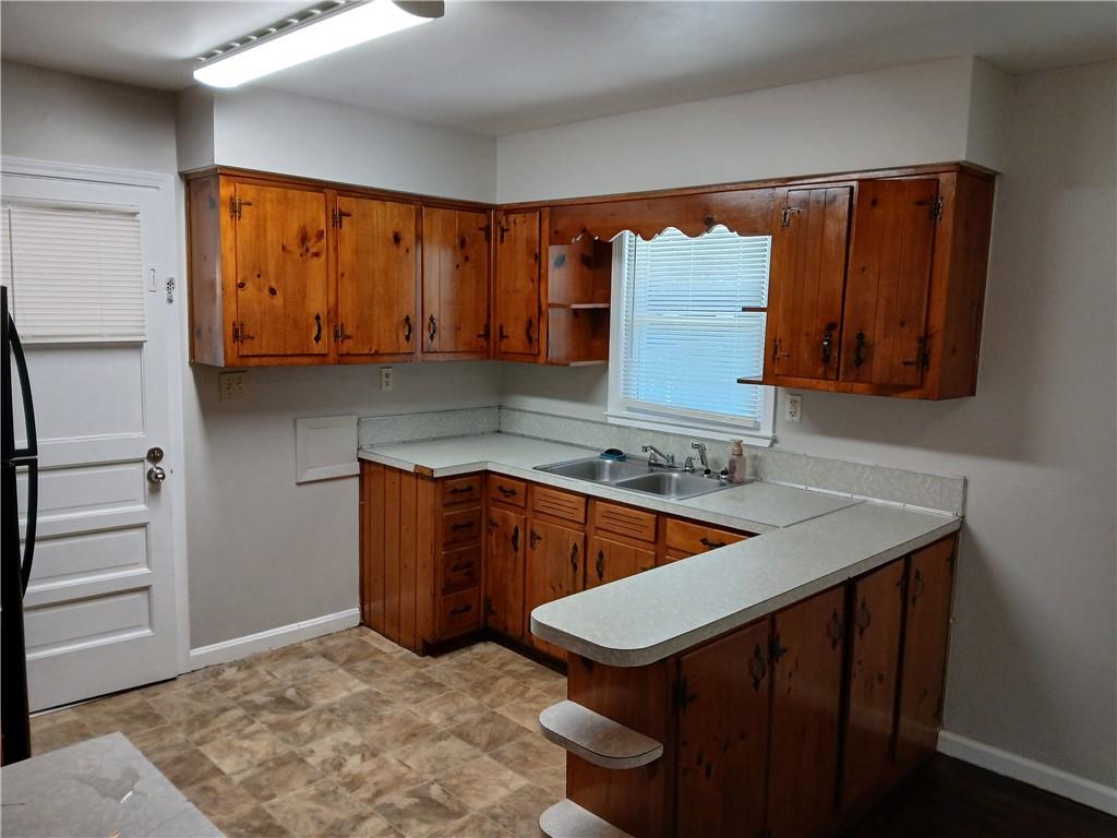 3175 Bellgreen Way Decatur, GA 30032 - Photo 4 of 10 a kitchen with stainless steel appliances granite countertop a sink and a microwave oven
