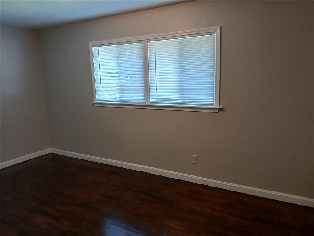 3175 Bellgreen Way Decatur, GA 30032 - Photo 7 of 10 a view of a small space with wooden floor and a window