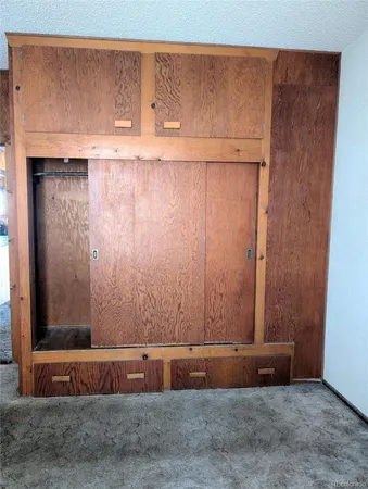 a view of room with wooden floor