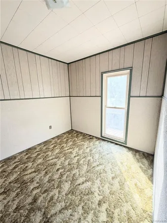 a view of a front door and bedroom