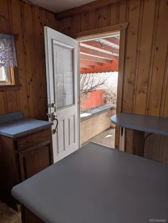 a view of a room with furniture and a window