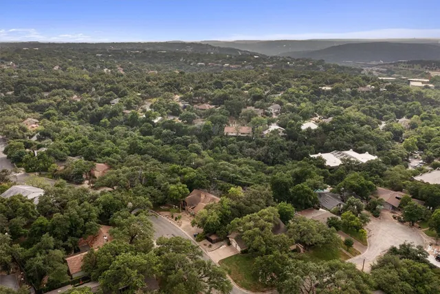 an aerial view of residential houses with city view and lake view