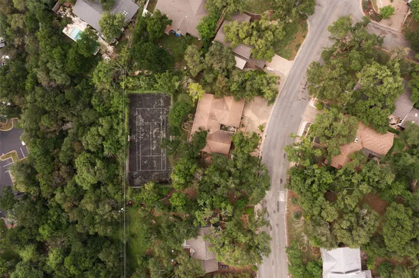 an aerial view of a house with yard