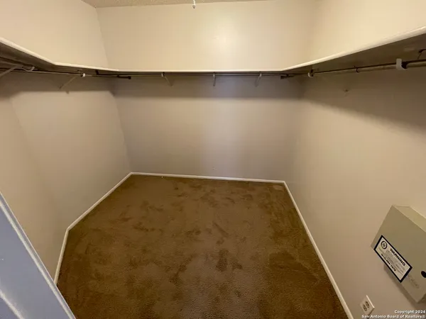 a view of a room with racks on the wall