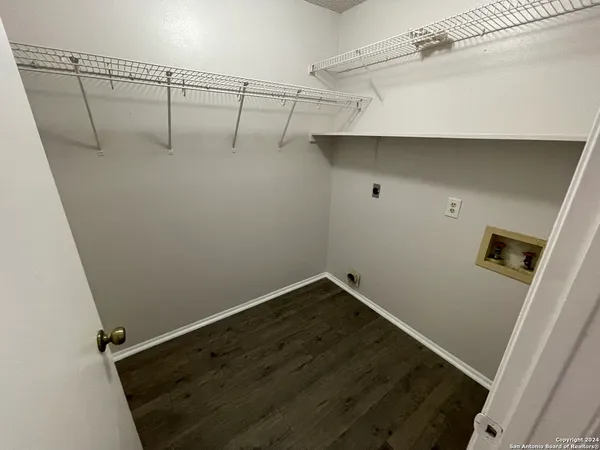 a bathroom with a sink toilet and a mirror