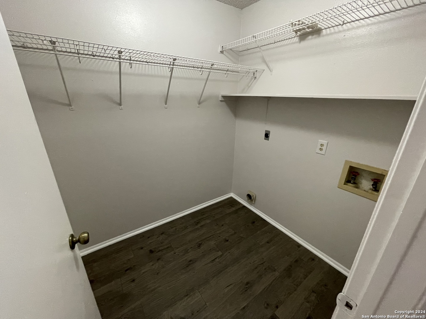 9235 Ridge Post San Antonio, TX 78250 - Photo 17 of 30 a view of a room with racks on the wall