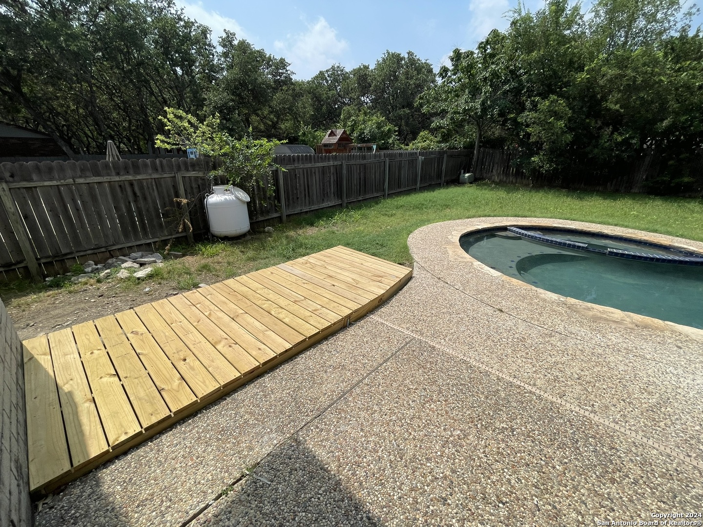 9235 Ridge Post San Antonio, TX 78250 - Photo 28 of 30 a view of outdoor space with swimming pool