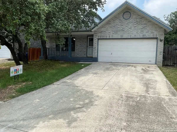 a front view of house with a garden
