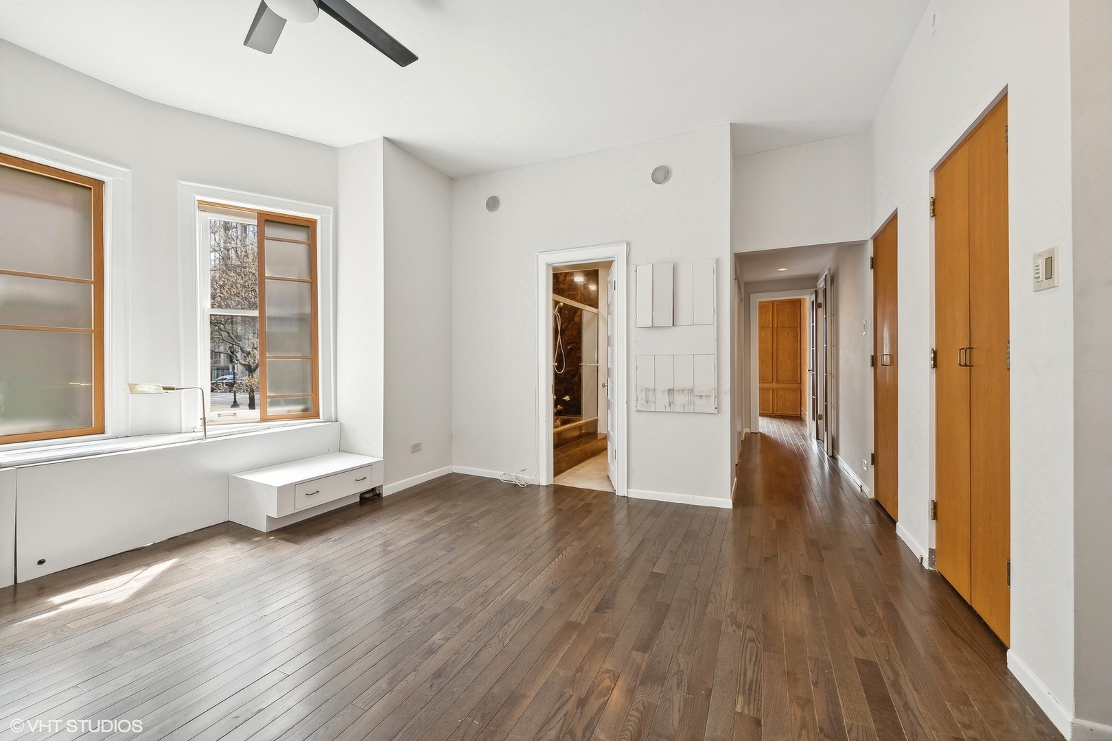 700 West Irving Park Road, Unit A1 Chicago, IL 60613 - Photo 12 of 20 a view of an empty room with window and wooden floor