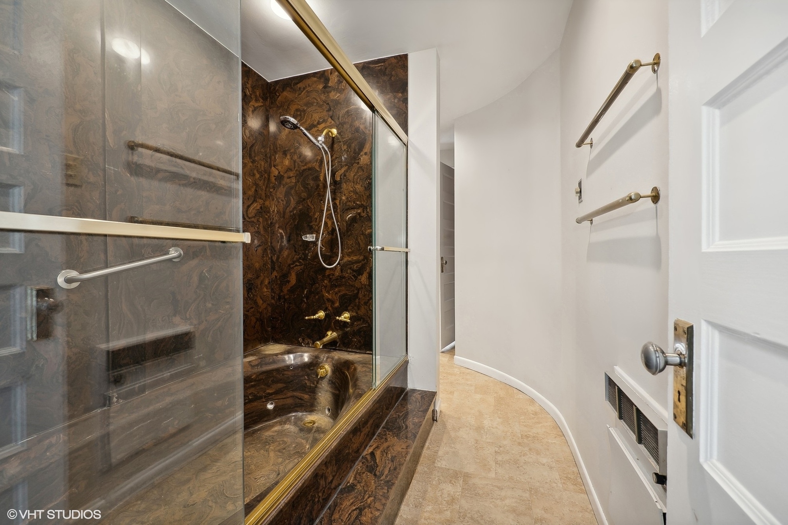 700 West Irving Park Road, Unit A1 Chicago, IL 60613 - Photo 13 of 20 a bathroom with a glass shower door and a bathtub