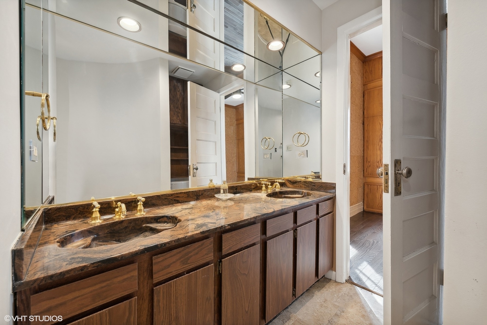 700 West Irving Park Road, Unit A1 Chicago, IL 60613 - Photo 14 of 20 a bathroom with a granite countertop sink and a mirror