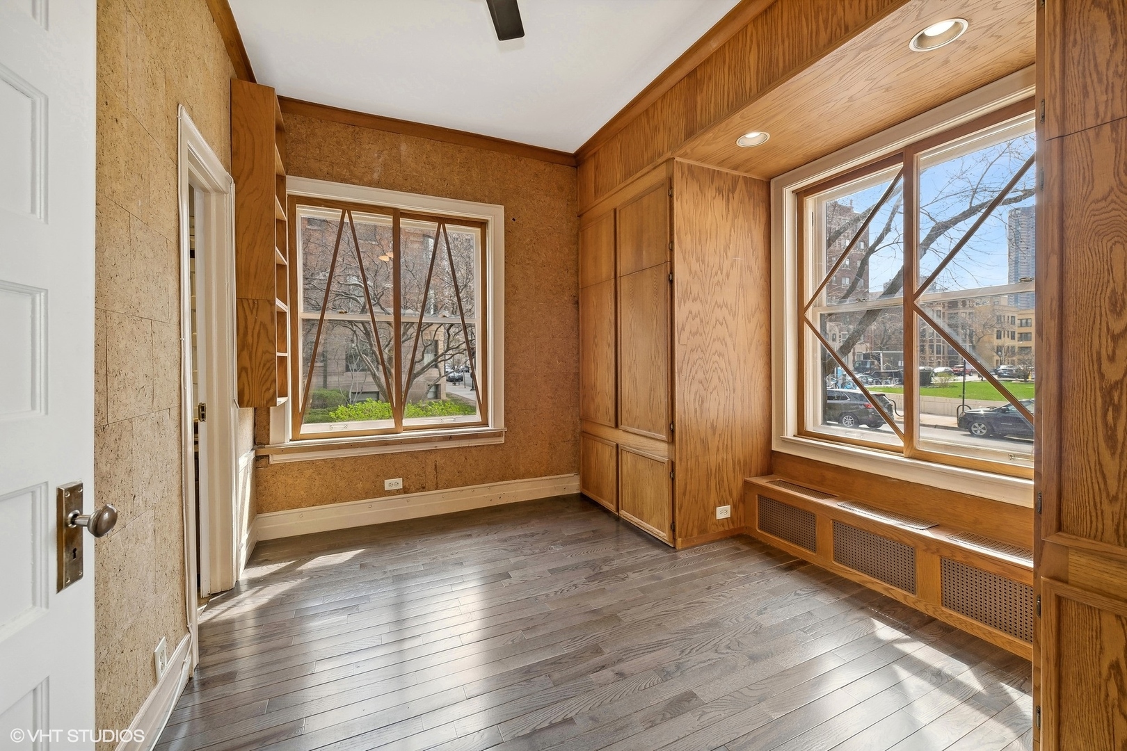 700 West Irving Park Road, Unit A1 Chicago, IL 60613 - Photo 16 of 20 a view of an empty room with a window and wooden floor
