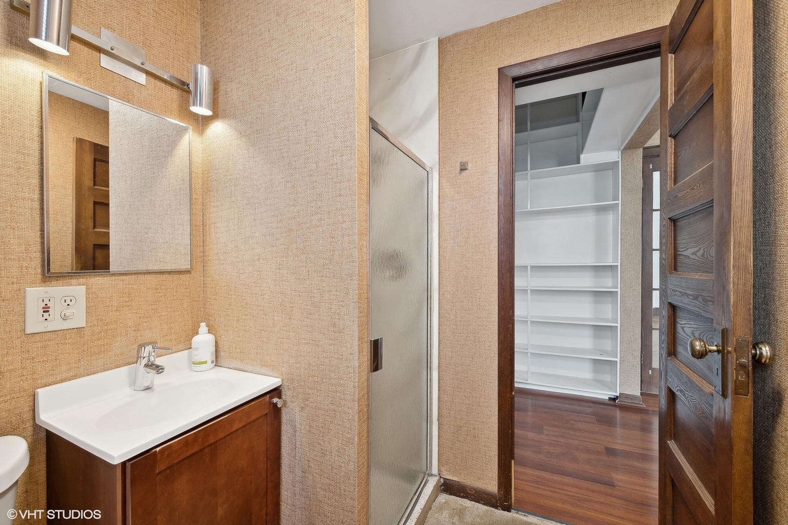 700 West Irving Park Road, Unit A1 Chicago, IL 60613 - Photo 19 of 20 a bathroom with a sink a toilet and a mirror