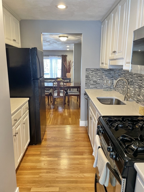 31 Blithewood Avenue, Unit 705 Worcester, MA 01604 - Photo 11 of 31 a kitchen with stainless steel appliances granite countertop a sink stove and refrigerator