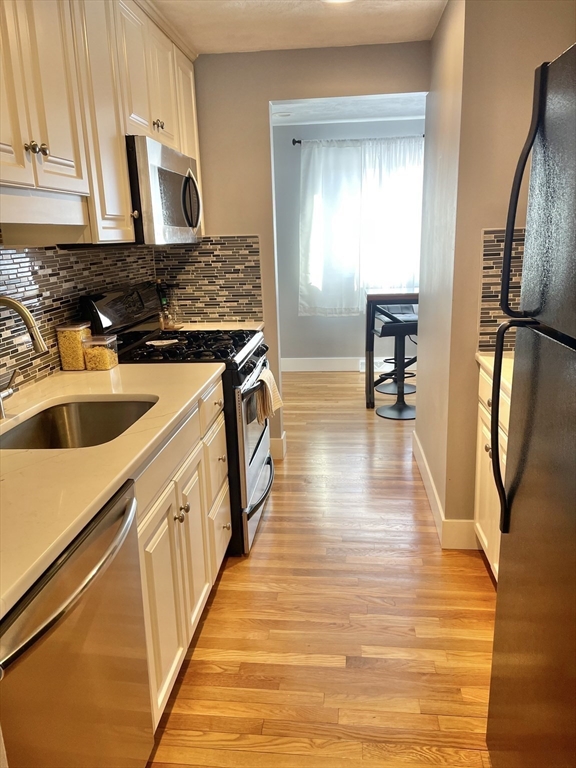 31 Blithewood Avenue, Unit 705 Worcester, MA 01604 - Photo 12 of 31 a kitchen with sink and refrigerator