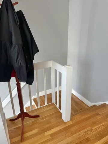 a very nice looking room with a large bed and wooden floor