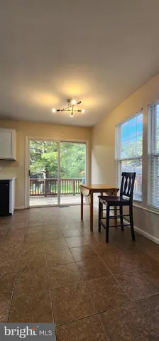 a view of dining room with furniture and window