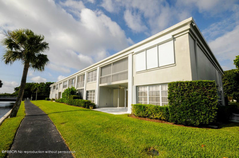 2195 Ibis Isle Road, Unit 6 Palm Beach, FL 33480 - Photo 14 of 15 a view of house with yard and green space