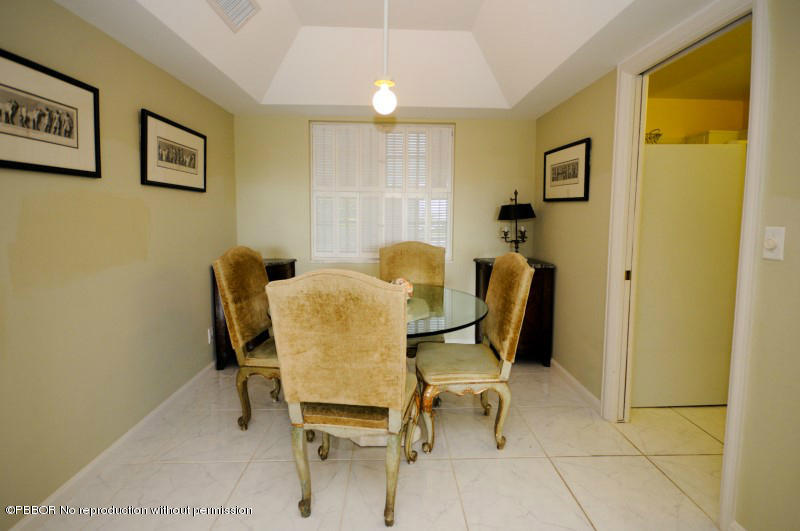 2195 Ibis Isle Road, Unit 6 Palm Beach, FL 33480 - Photo 7 of 15 a dining room with furniture and window