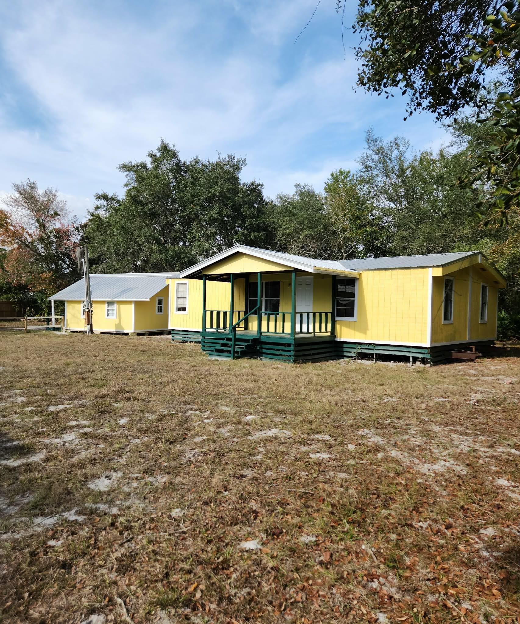 890 Poinsettia Road, Unit B St. Augustine, FL 32086 - Photo 3 of 14 Manufactured / mobile home featuring a porch and a front yard