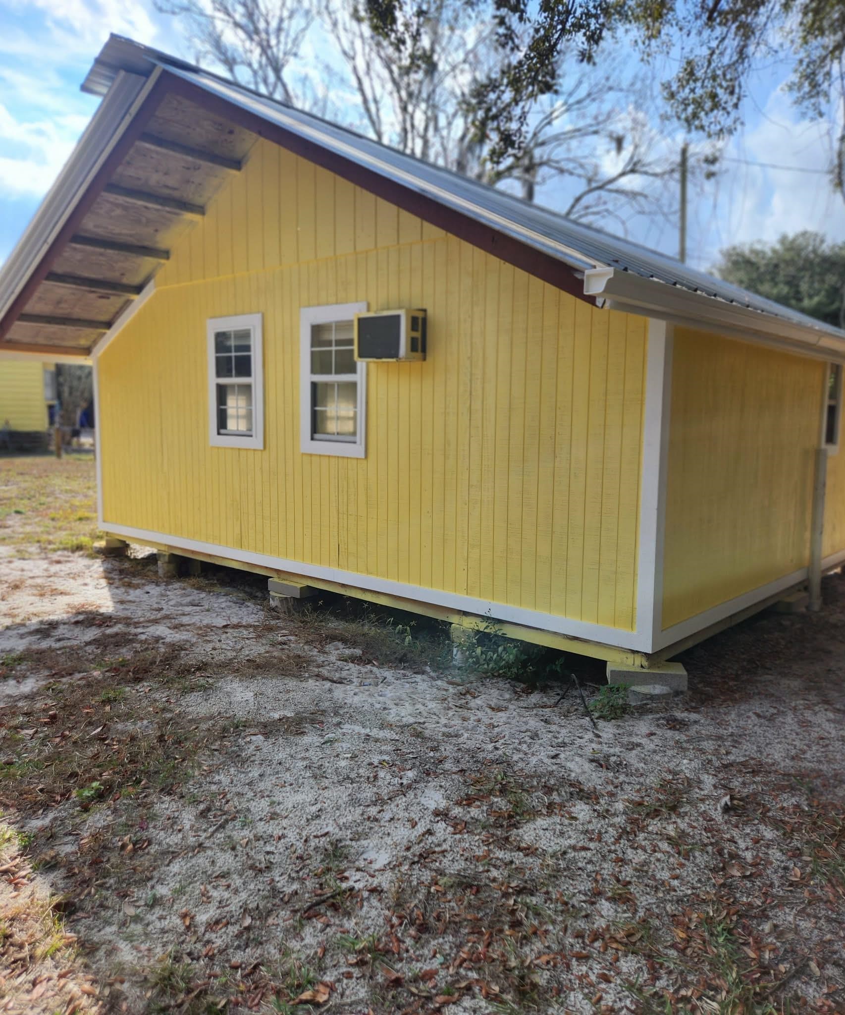 890 Poinsettia Road, Unit B St. Augustine, FL 32086 - Photo 4 of 14 View of side of home with a metal roof