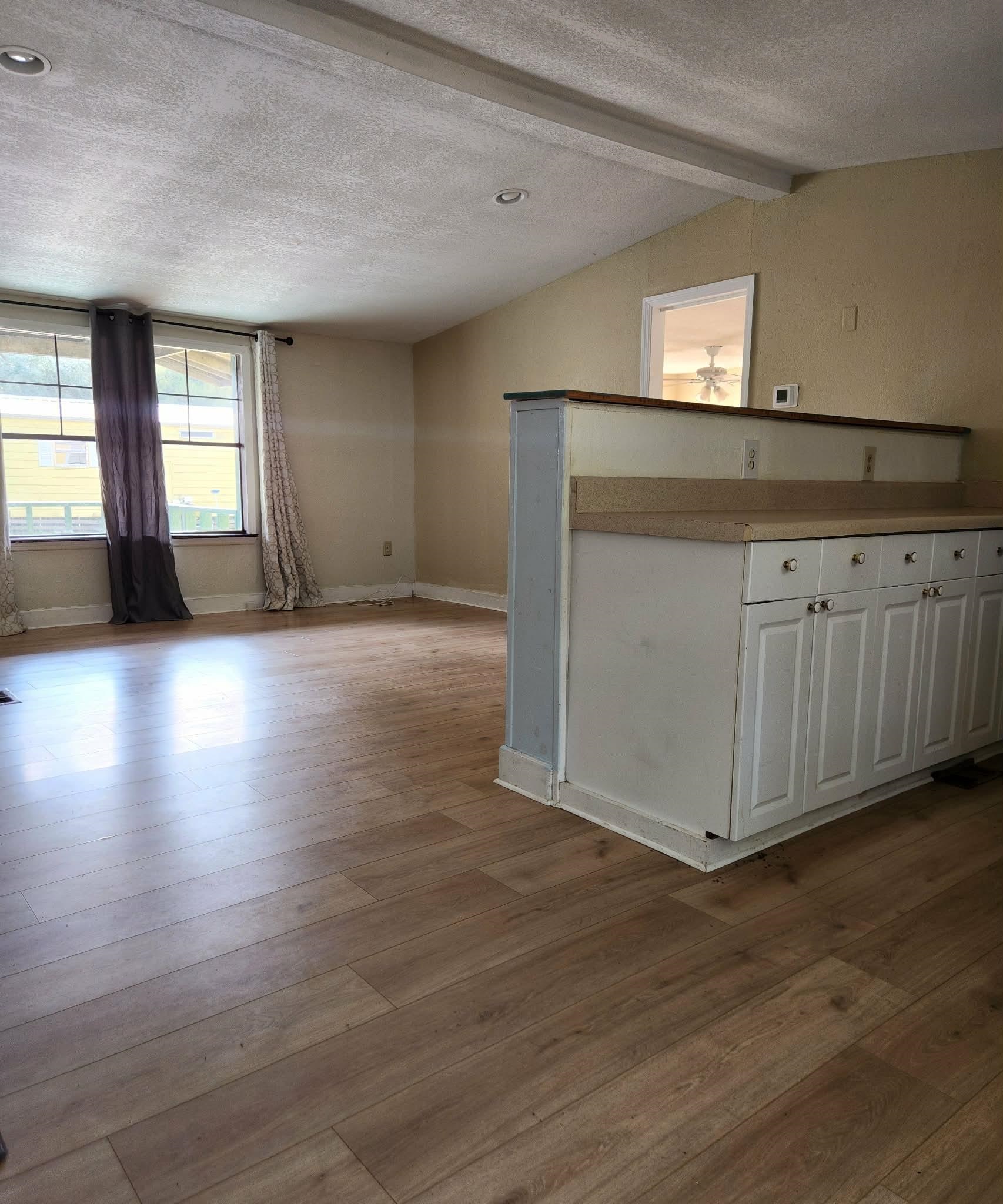 890 Poinsettia Road, Unit B St. Augustine, FL 32086 - Photo 7 of 14 Unfurnished room with light wood-style flooring and baseboards