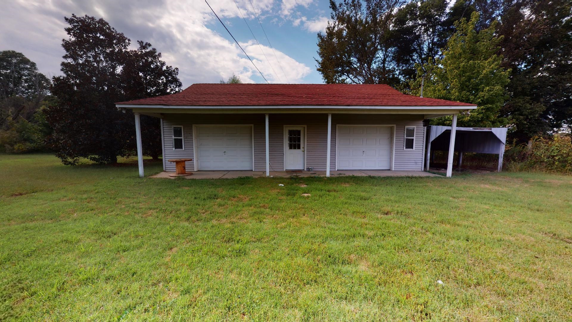 772 Cobb Road Newbern, TN 38059 - Photo 12 of 13 a front view of a house with garden